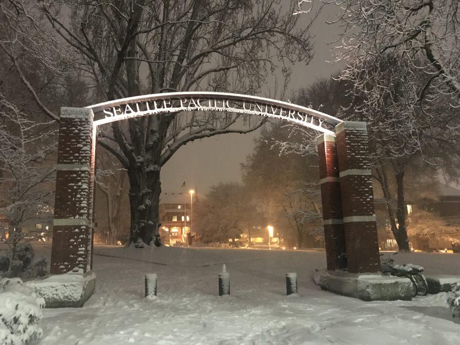 The Seattle Pacific University sign still shines bright through the snow at night.

Marissa Lordahl | The Falcon
