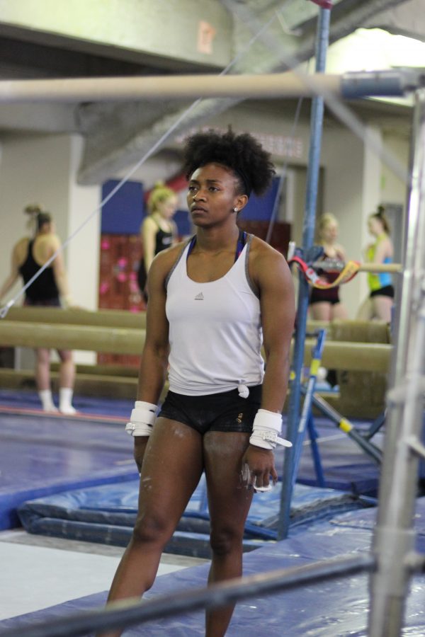Darian Burns practices the uneven bars routine.

Maileca Gontinas | The Falcon