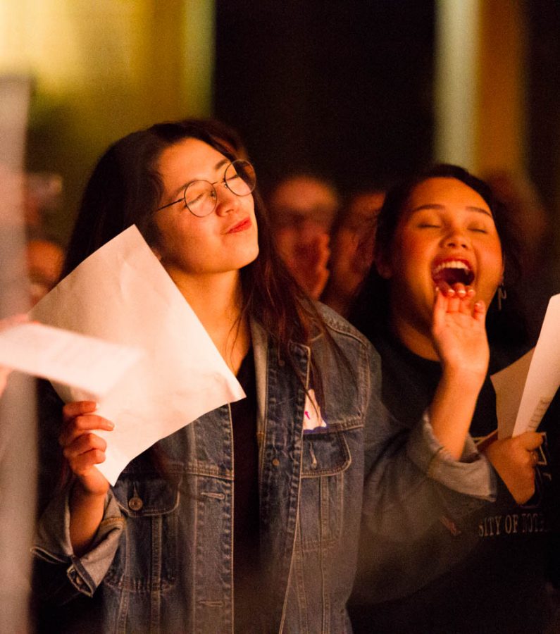 Student, Ada Campos, engages in the worship as students are asked to call out in the song, Latin American Roll Call.