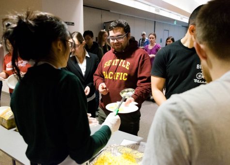 A man is served food in a line