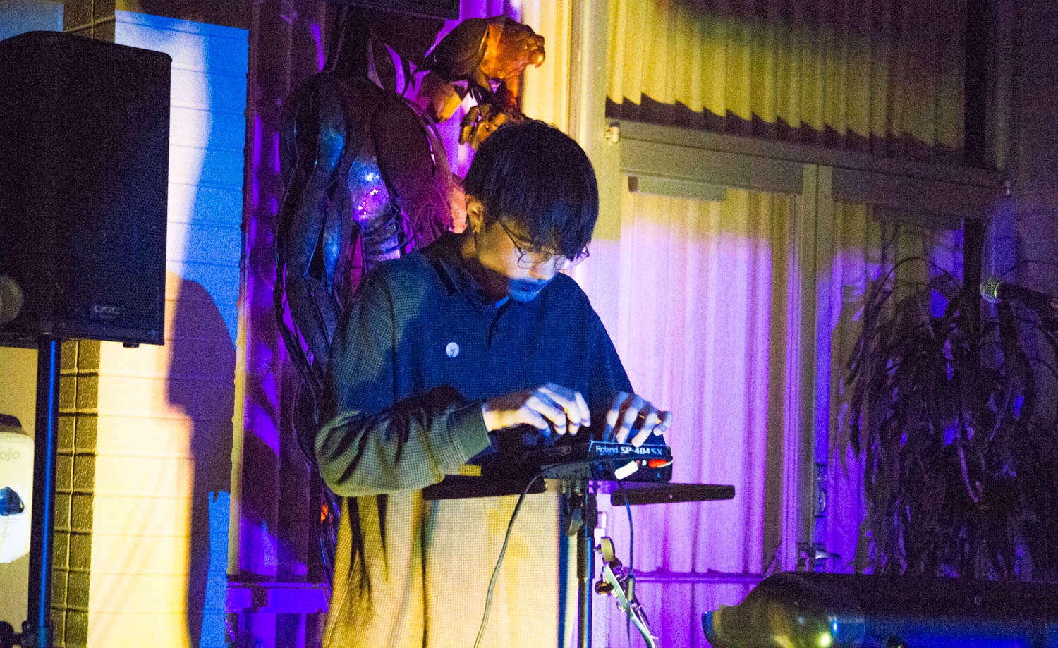 Owen Sweeney playing an electronic musical instrument.