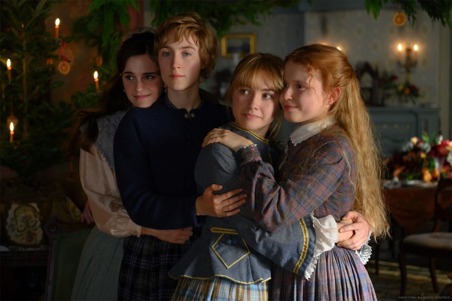 Meg (Emma Watson), Jo (Saoirse Ronan), Amy (Florence Pugh) and Beth (Eliza Scanlen) locked in an embrace on Christmas day. 

