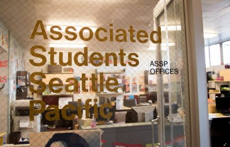 an office window that reads "Associated Students Seattle Pacific"