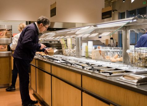 a man gets food at a pcc market