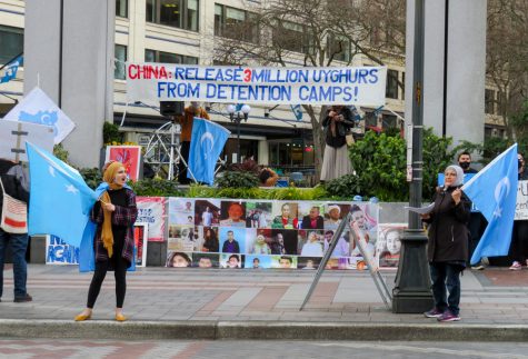 protestors wave flags and demand the release of 3 million uyghurs from detention camps in china