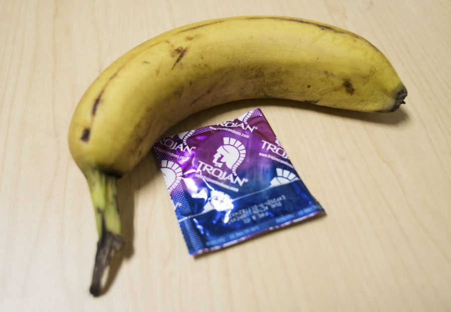 a banana with a condom next to it