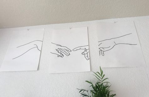 a drawing of two hands touching