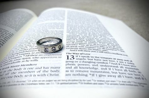 a purity ring sitting on a bible