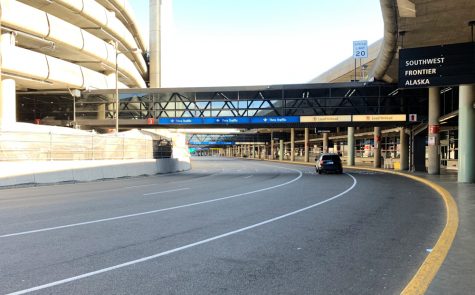 An empty arrivals pickup area at an airport