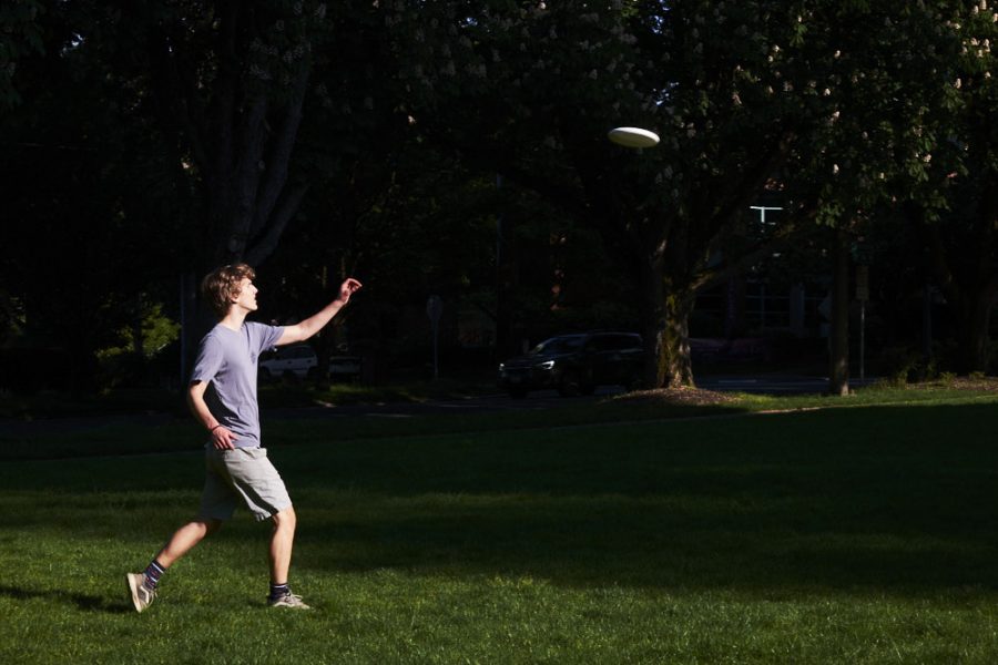 a man catches a frisbee