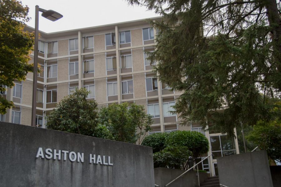 The front of a building with a concrete sign saying Ashton Hall