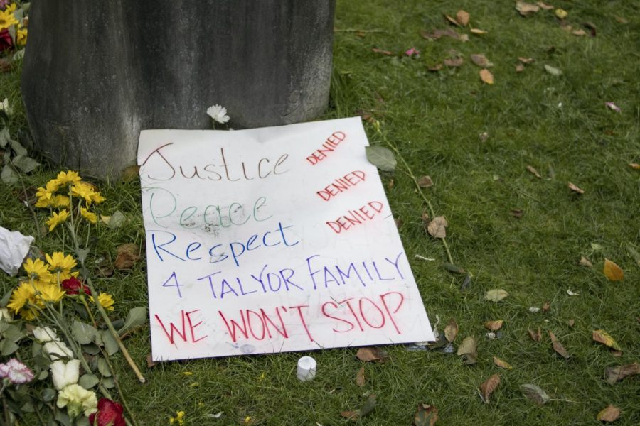 Sign made by protestors that demands justice, peace, and respect for the Taylor family over police brutality.