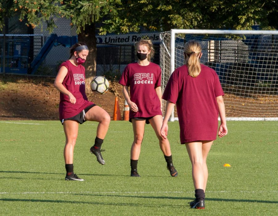 Redshirt Sophomore Samea Aljundi and Sophomore Makena Rietz juggle a soccer ball during practice. Soccer is practicing in groups of five or less following COVID-19 guidelines. 