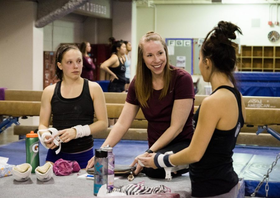 FILE - Head Coach Sarah Marshall took over the Seattle Pacific Gymnastics program for the 2020 season, here she discusses the first meet of the season with Corrin Coons and Jadacie Durst.