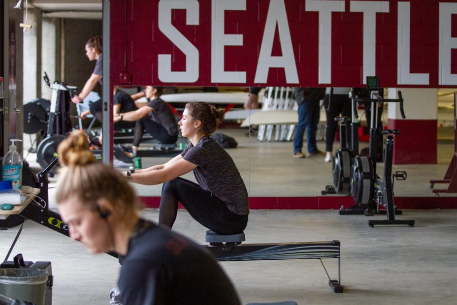 Megan Chalfant, a senior on the Varsity Womens Rowing Team, trains on a rowing machine during practice.