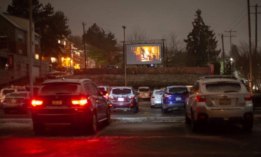 Cars pull into Emersons back parking lot to catch the Valentine weekend showing of Crazy Rich Asians a few cars keep their engines running hoping to stay warm in the ongoing snow storm.