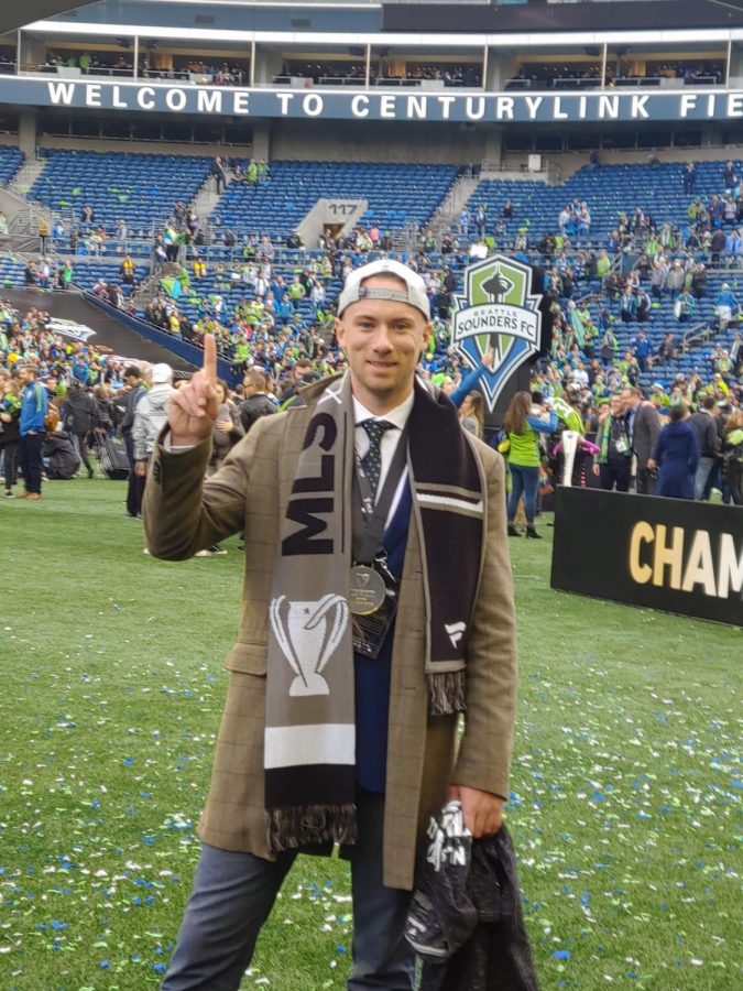 Sinser, director of player personal for the Sounders, celebrates the Sounders MLS Cup win in 2019.