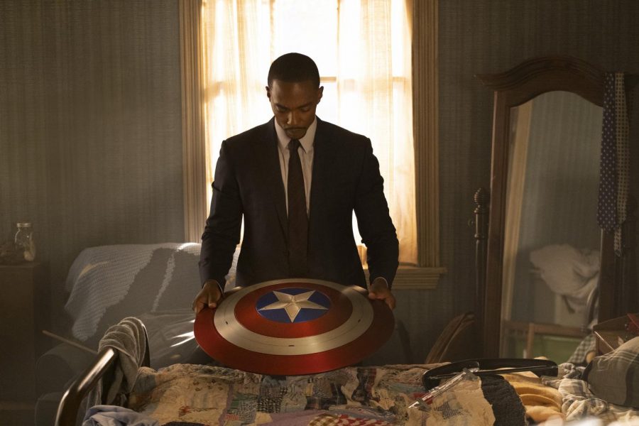 Sam Wilson reflects as he looks at Captain Americas shield.