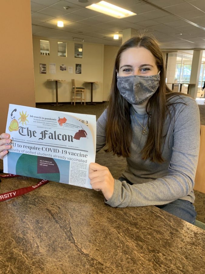 Second-year student Jenna Gillam in Weter Hall with a copy of The Falcon. (Courtesy of Jenna Gillam)