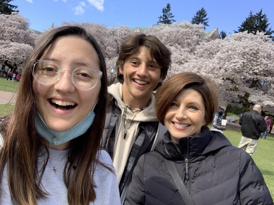 Hailey Echan takes time to show her brother, Ethan, and mom, Amy, around the UW cherry blossoms. (Courtesy of Hailey Echan)