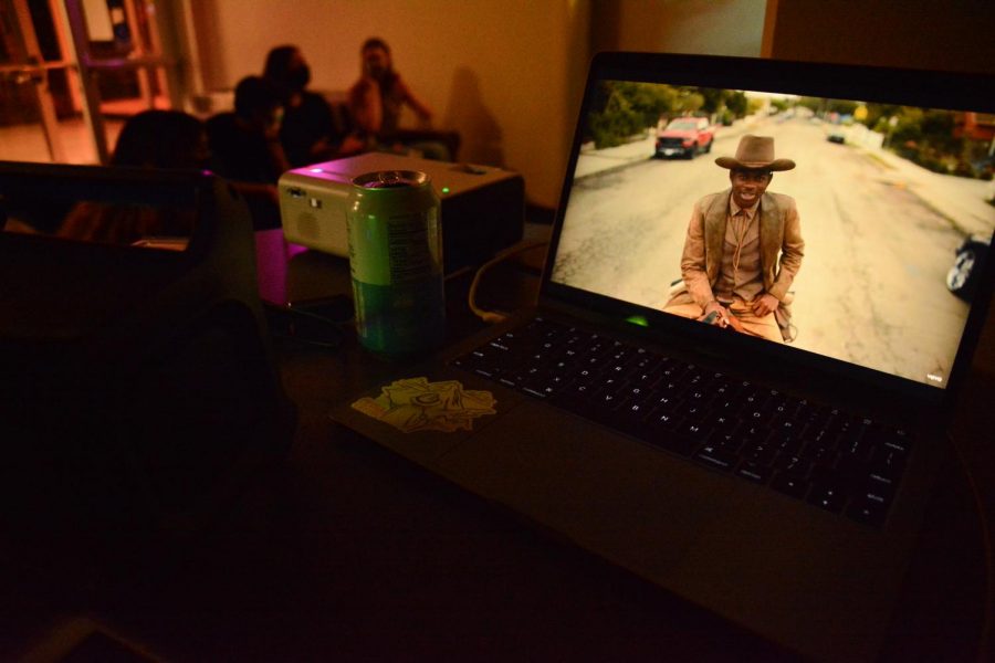 A Lil Nas X music video is playing on a laptop the night of the listening party in Weter Memorial Hall. (Devin Murray)