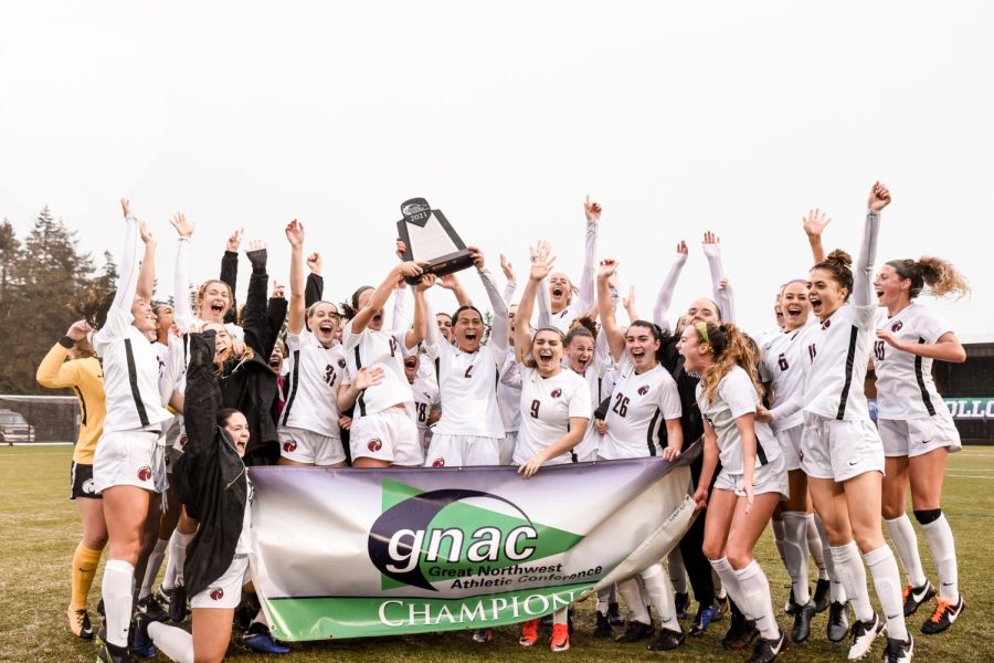The Seattle Pacific University womens soccer team with their trophy and GNAC champions banner after their big win. (Courtesy of Christian Serwold)