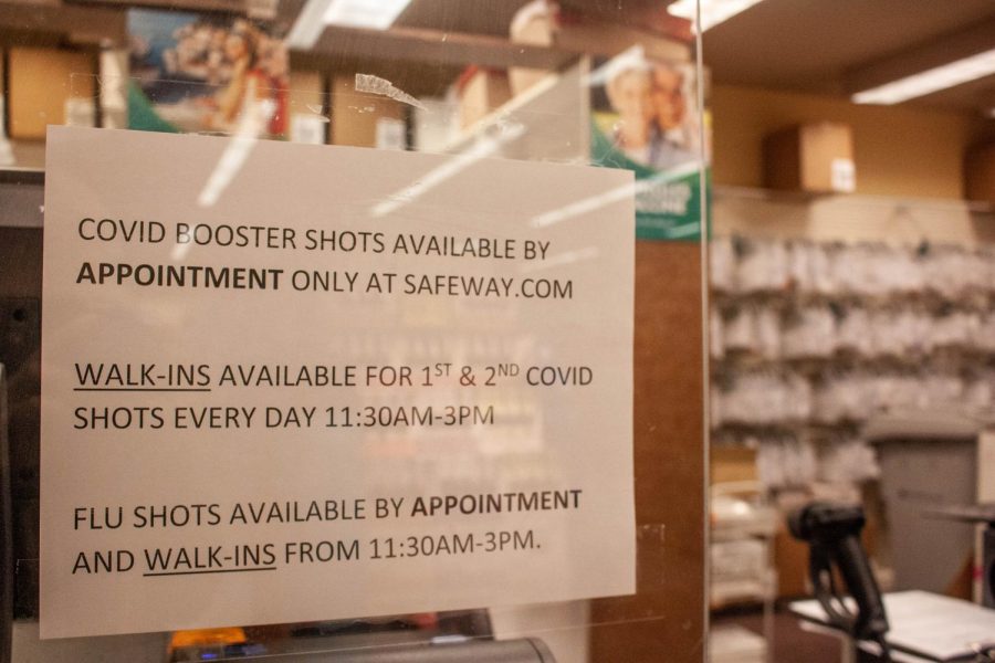Advertisements at a local Safeway pharmacy helps to inform customers of when and how they can obtain a COVID booster shot. (Gabrialla Cockerell)