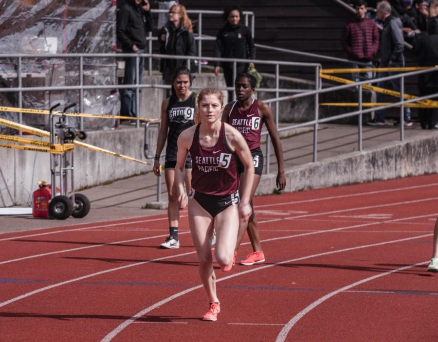 Sophomore distance runner Ellie Rising takes a practice start before the 800m at the Doris Heritage track festival. (Rio Giancarlo)