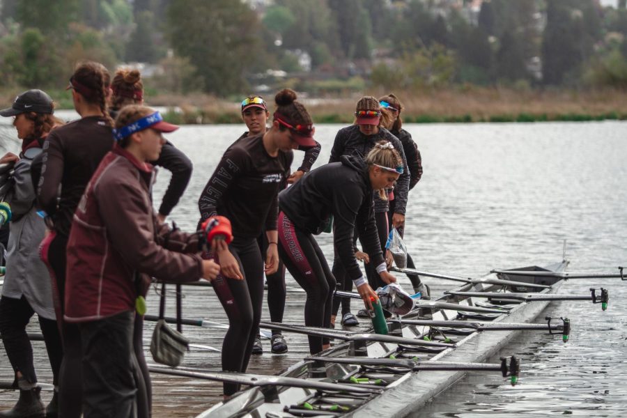The SPU Varsity Eight loads the boat at a previous event. (Rio Giancarlo)

