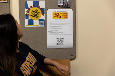 Sophomore Hiyan Zamora looks at a casting call for the SPU theater departments winter play that is posted in Weter Hall. Auditions were held in September and the play will run February 2nd-4th and 9th-11th.