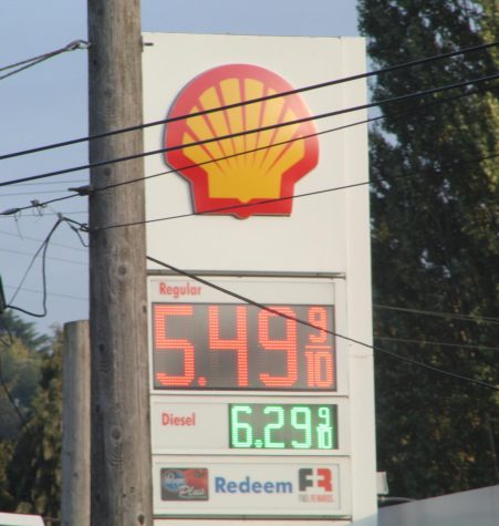 A electronic sign displays gas prices at a Shell gas station near Seattle Pacific University in Seattle, Wash. in early September. As US inflation continues, consumers continue to  face higher prices in many products. 