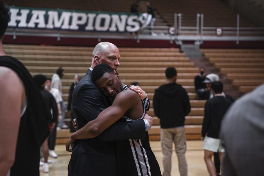 Coach Grant Leep console Senior Guard Divante Moffitt after being knocked out of the GNAC tournament on March 3, 2022. Moffitt entered the transfer portal at the end of last year and currently plays for the University of Idaho.