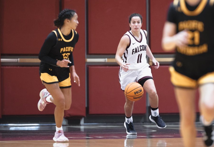 Chiara De Virgilio (11) carries the ball down the court during the third quarter of Seattle Pacifics exhibition game against Pacific Lutheran on Nov. 5, 2022.