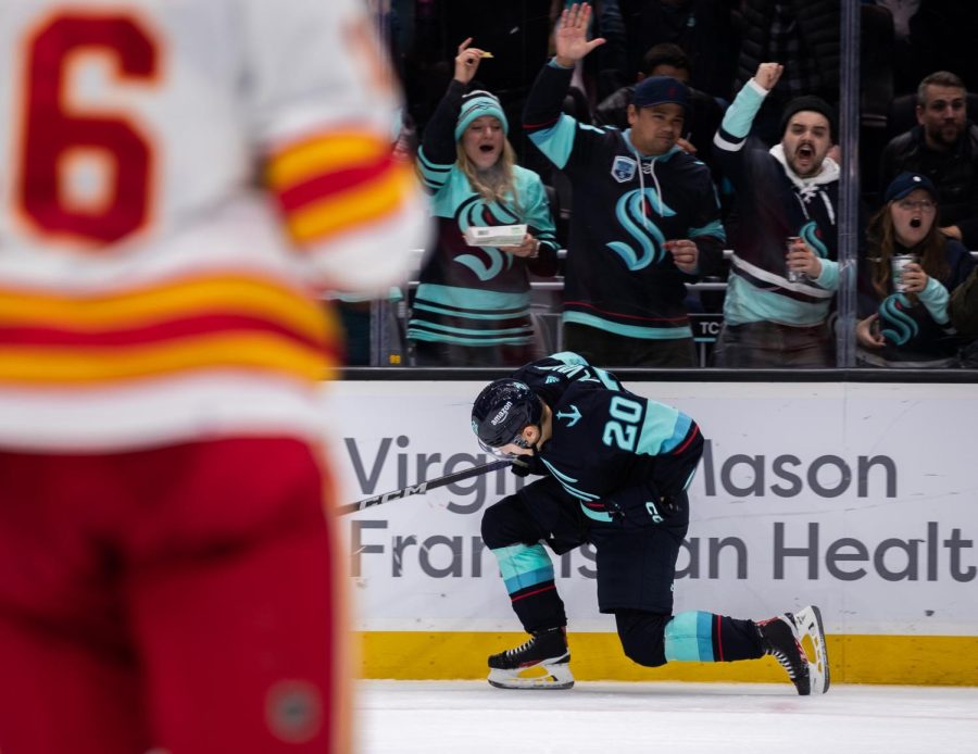 Seattle Kraken right wing Eeli Tolvanen (20) fist pumps in celebration after scoring in the third period against the Calgary Flames in an NHL game at Climate Pledge Arena in Seattle on Jan 27, 2023. The Flames defeated the Kraken 5-2. 