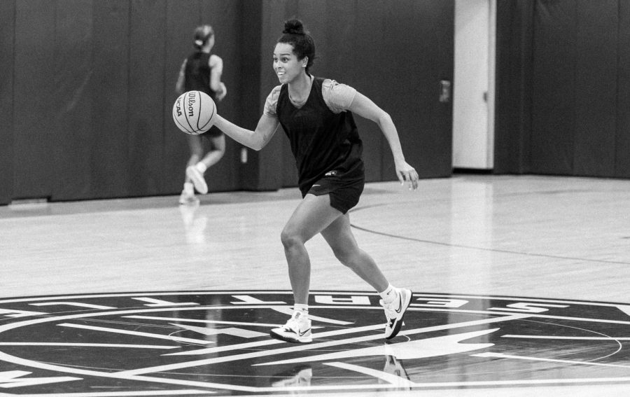 Natalie Hoff dribbles the ball during a practice in the Seattle Storm practice gym in Royal Brougham Pavilion on Oct. 14, 2022. During the season SPU students may catch Seattle storm athletes and staff in and around Royal Brougham.