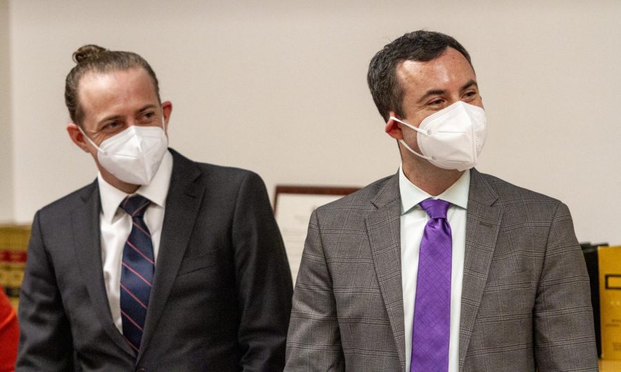 Attorneys Joe Baxter, left, and Paul Carlos Southwick, right, stand as Judge Andrea Darvas enters the courtroom at the King County Courthouse in Seattle, Wash., Friday, Feb. 17, 2023.
