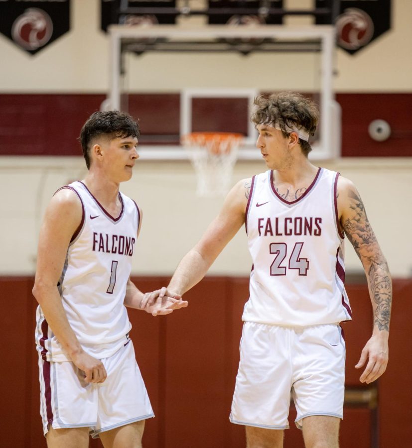 Shaw Anderson and Zak Paulsen low-five during their game against Simon Fraser at Royal Brougham Pavilion on Feb. 4, 2023 in Seattle, Wash.