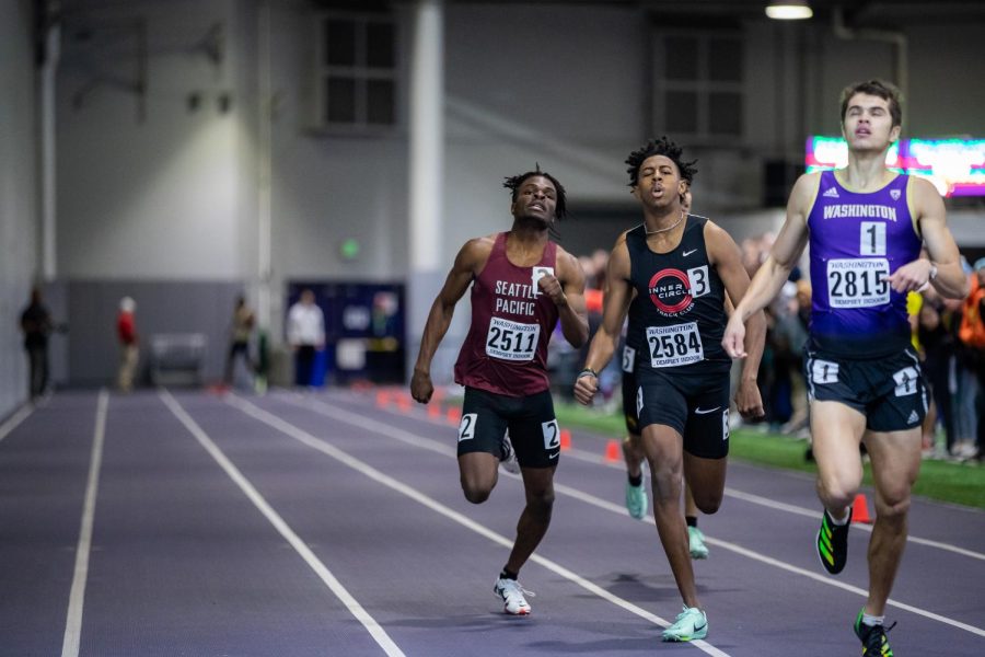 Sophomore Isiah Archer sprints to the finish en route to setting a new school indoor 400m record at the Dempsy Indoor facility in Seattle, Washington. The 400 is another event that differs from its outdoor counterpart, allowing athletes to collapse into lane one later in the race compared to staying in your lane the whole race outdoors.