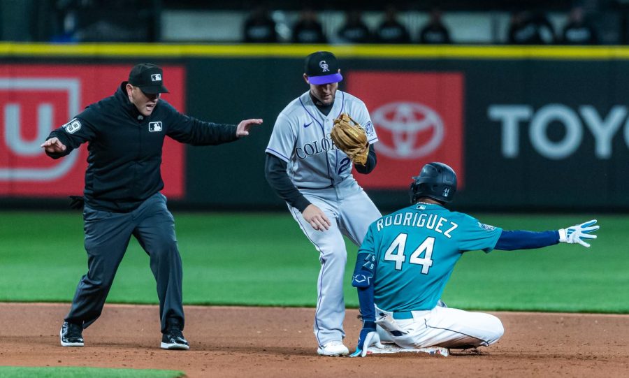 Seattle Mariners center fielder Julio Rodriguez (44) slides in to second base after hitting a RBI double during the fourth inning of a baseball game Friday, April 14, 2023, in Seattle. The Mariners won 5-3.