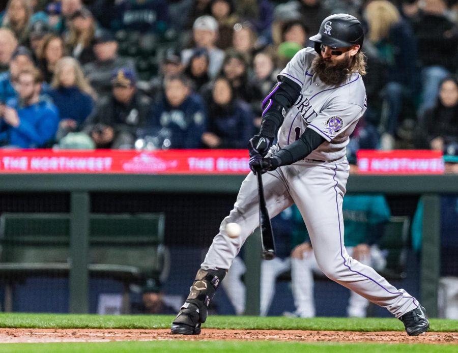 Colorado Rockies designated hitter Charlie Blackmon (19) singles toto right field during the sixth inning of a baseball game Friday, April 14, 2023, in Seattle. The Mariners won 5-3.