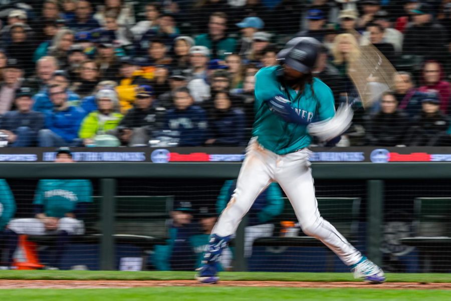 Seattle Mariners shortstop J.P. Crawford (3) swings at the ball during the sixth inning of a baseball game Friday, April 14, 2023, in Seattle. The Mariners won 5-3.