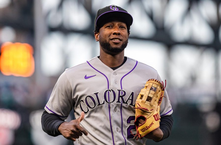 Colorado Rockies left fielder Jurickson Profar (29) heads to the dugout after warm-ups ahead of a baseball game Friday, April 14, 2023, in Seattle. The Mariners won 5-3.