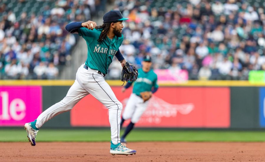 Seattle Mariners shortstop J.P. Crawford (3) throws to first during the first inning of a baseball game Friday, April 14, 2023, in Seattle. The Mariners won 5-3.