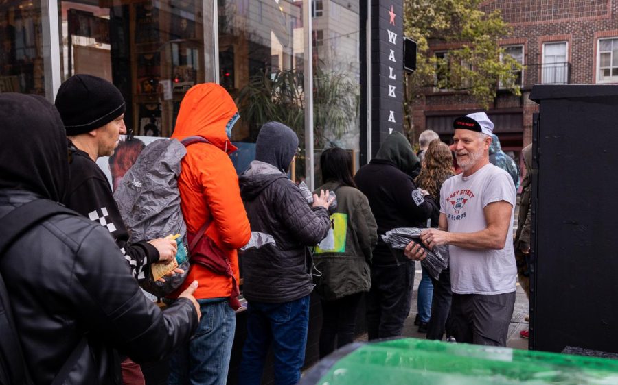 Easy Street Records founder Matt Vaughan hands out t-shirts to customers waiting in line on Record Store Day, Saturday, April 22, 2023.