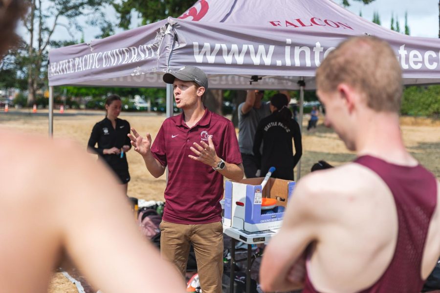 SPU Cross Country Head Coach Chris Reed speaks with his team after the Puget Sound Invitational in Seattle on Saturday, Sept. 3, 2023.