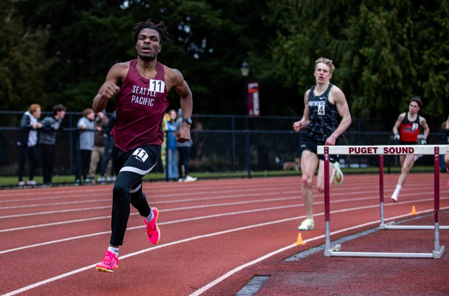 Seattle Pacific University middle distance runner Isaiah Archer sprints to the lead of his heat of the 800m race at the  Ed Boitano Invitational at the University of Puget Sound on Saturday, March 4, 2023.