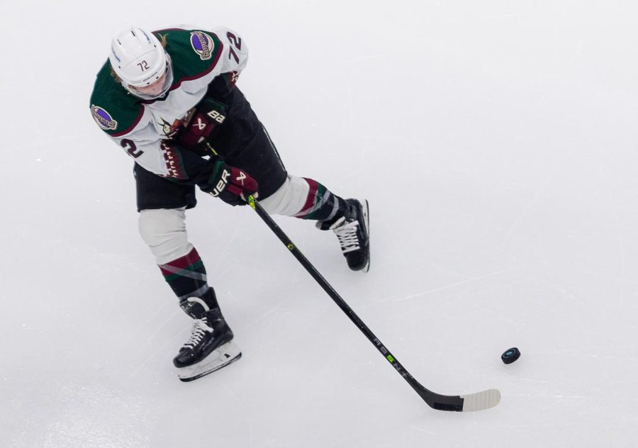 Arizona Coyotes center Travis Boyd (72) passes the puck during the first period of an NHL hockey game between Seattle Kraken and the Arizona Coyotes on Thursday, April 6, 2023, in Seattle. The Kraken won 4-2 clinching a playoff spot for the first time in franchise history. 