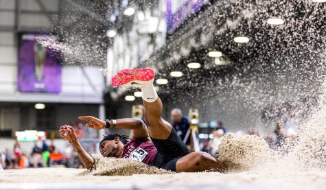 David Njeri lands in the pit during the triple jump at the Husky Invite in Seattle, Washington on Friday, Feb. 10, 2023.