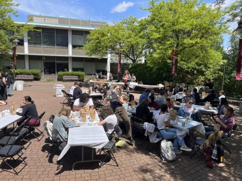 Students enjoy their free Chipotle in Martin Square on Tuesday, May 24, 2023.