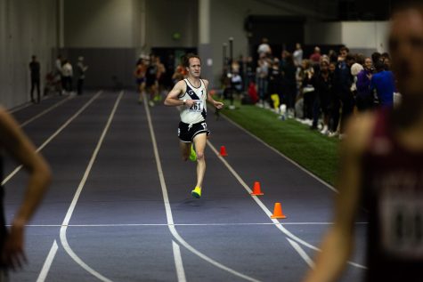 Seattle Pacific alumni Turner Wiley (now running for Club Northwest) crosses the finish line at the Dempsy Indoor facility during a track and field meet on Saturday, Jan. 14, 2023.